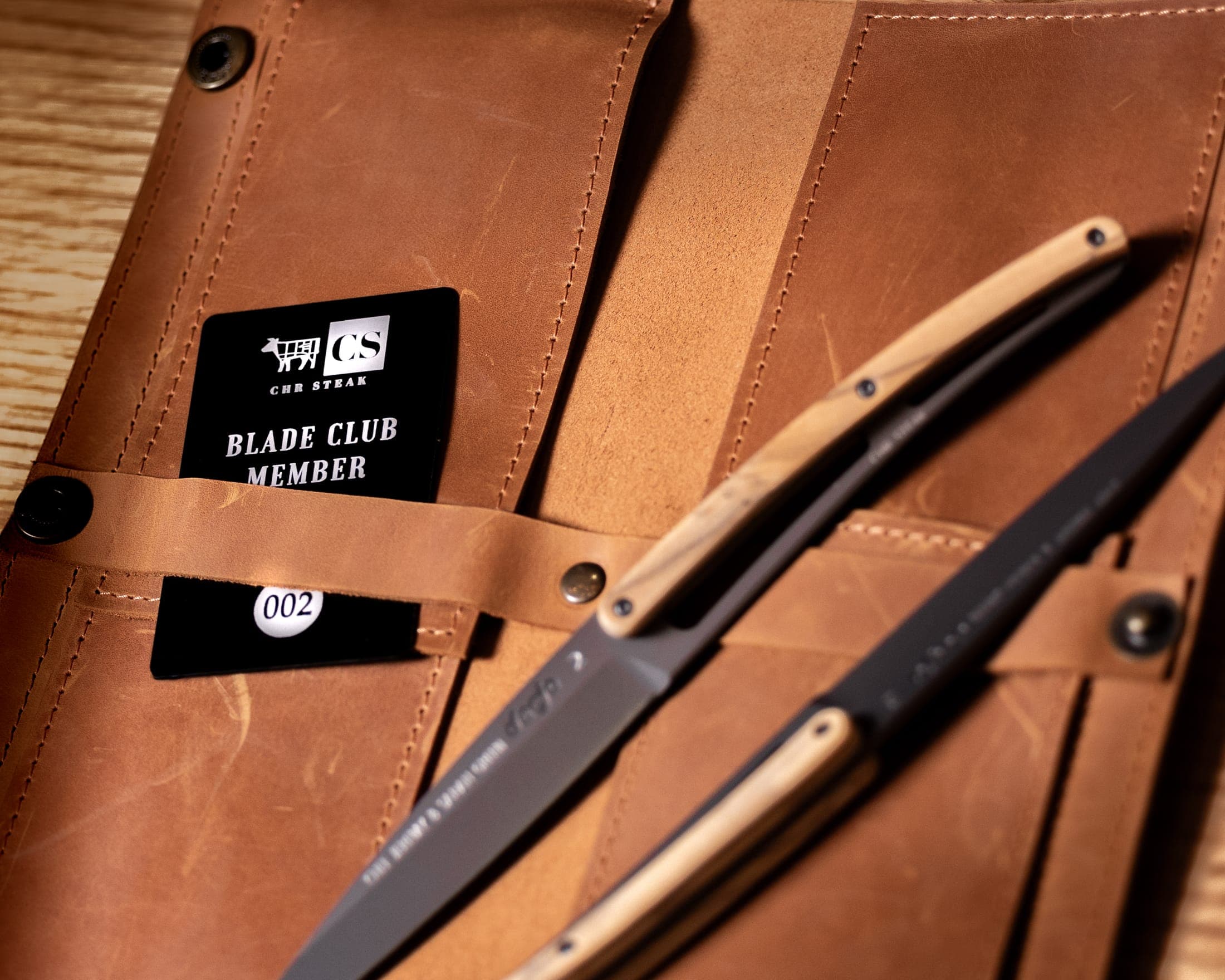 Blade Club member card and engraved knives in their leather roll at CHR Steak