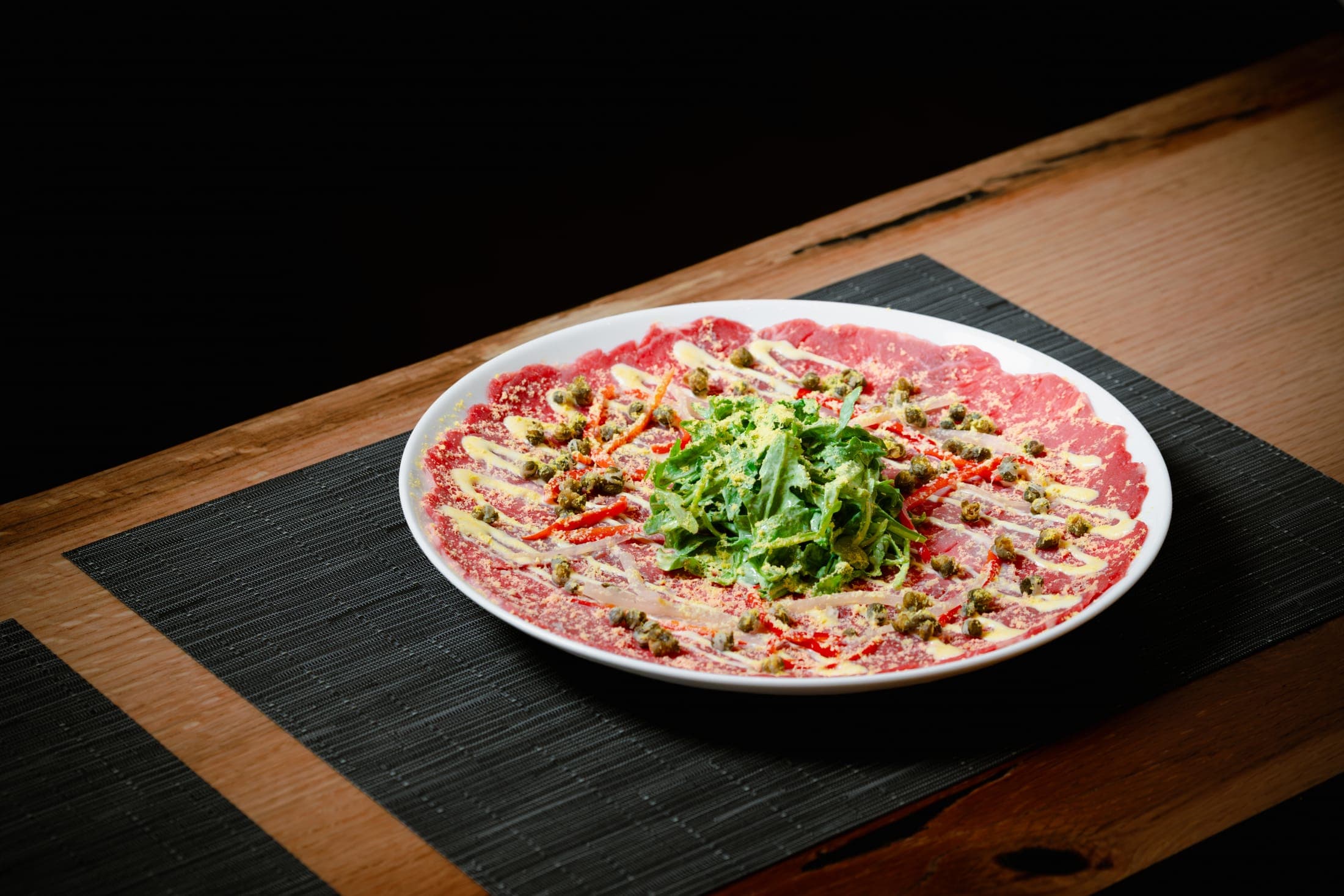 Tenderloin carpaccio with arugula, capers, and shaved parmesan at CHR Steak