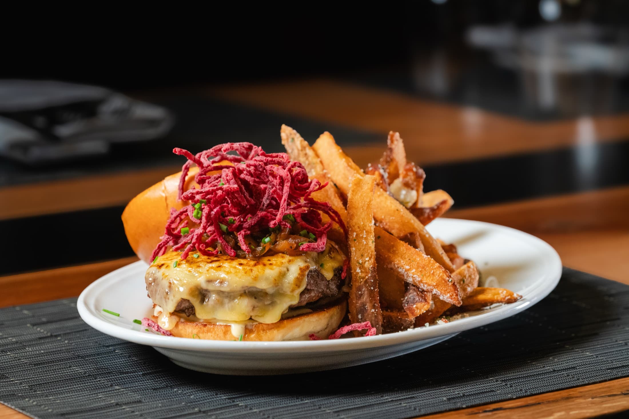 Wagyu Blade Burger with melted cheese and beef tallow fries at CHR Steak