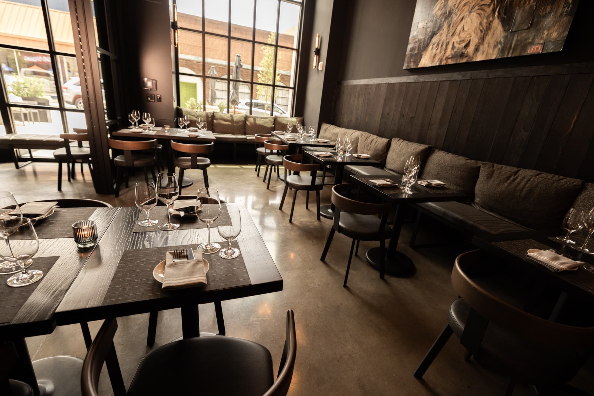 Set tables and banquette seating in the Executive Suite private dining room at CHR Steak in Gainesville, Georgia