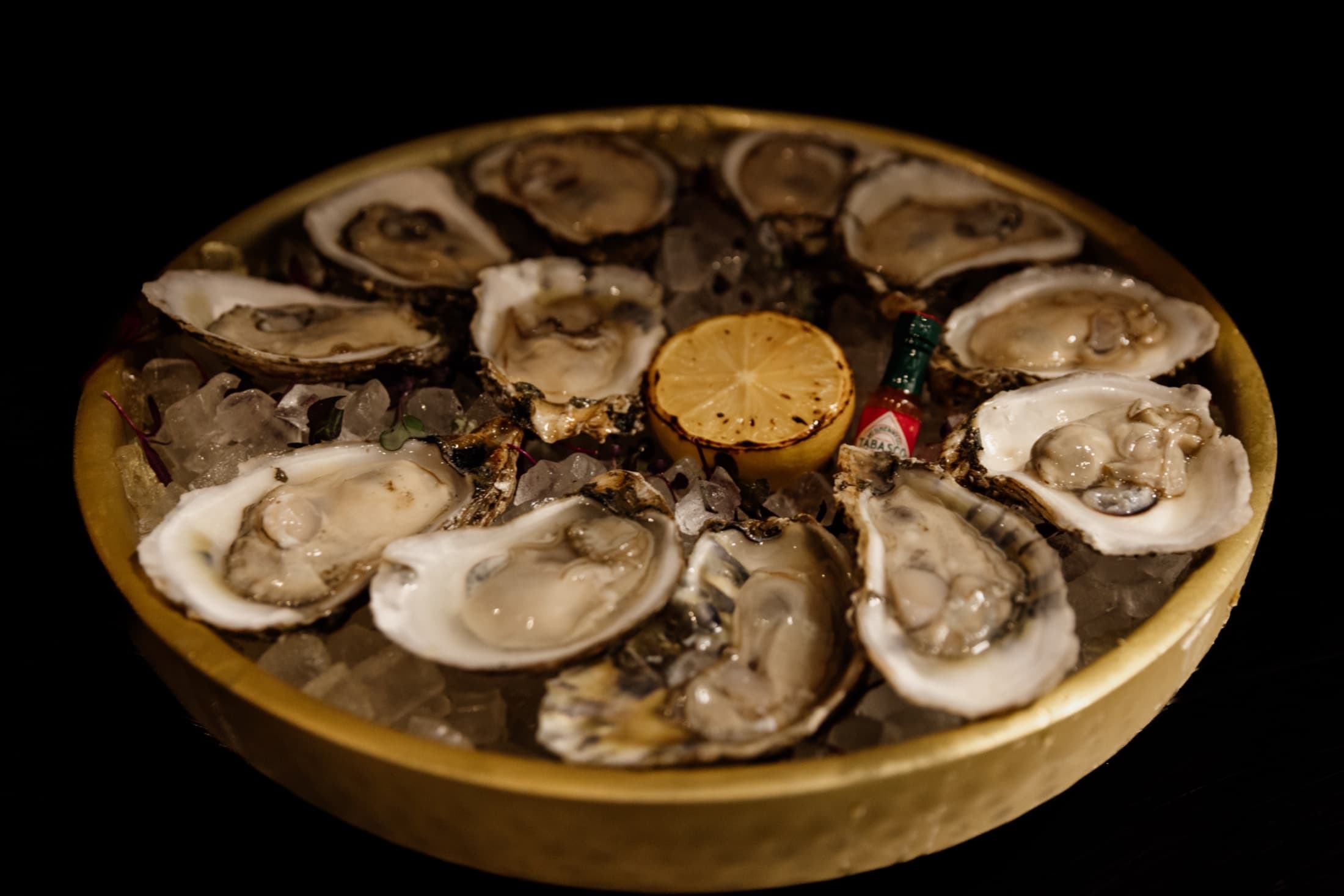 Fresh oysters on the half shell from the CHR Steak raw bar